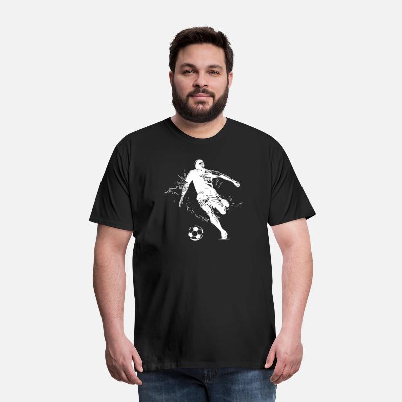 Soccer Player Kicks A Soccer Ball